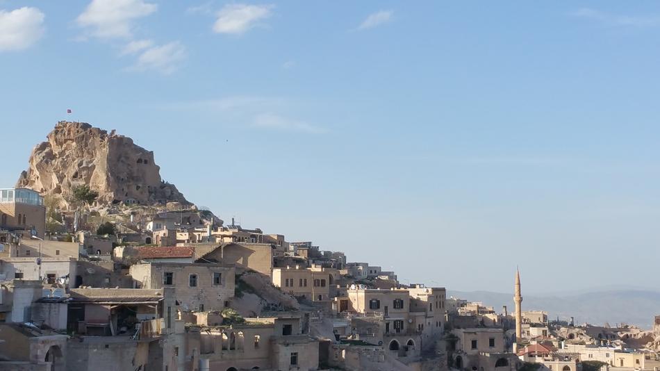 old city on mountain slope at sea, Turkey, Cappadocia