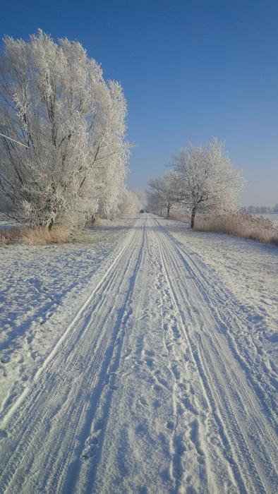 long trail through scenic countryside on snowy winter