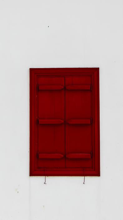 red wooden shutters in the house