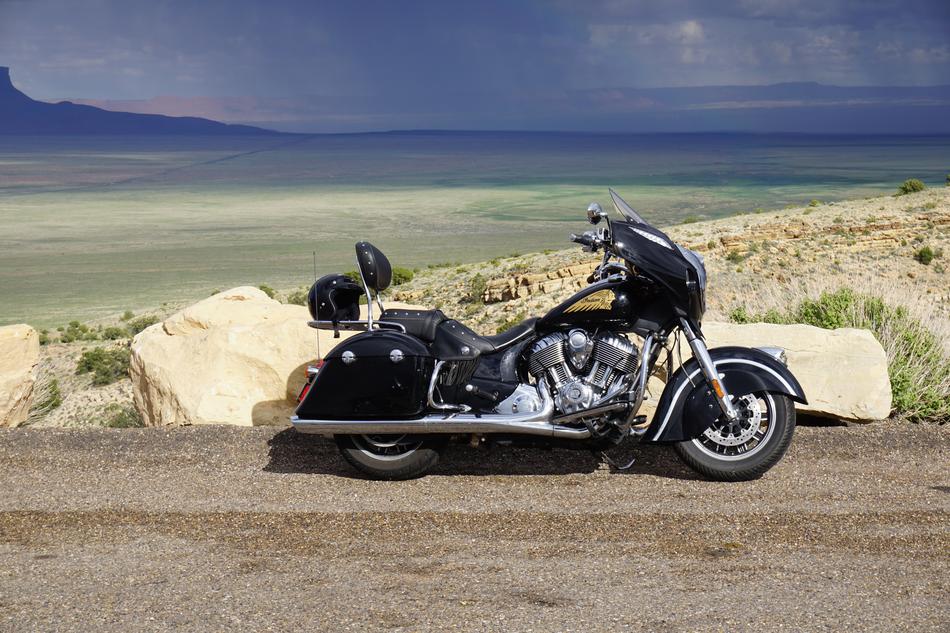 black luxury indian motorcycle parked in wilderness