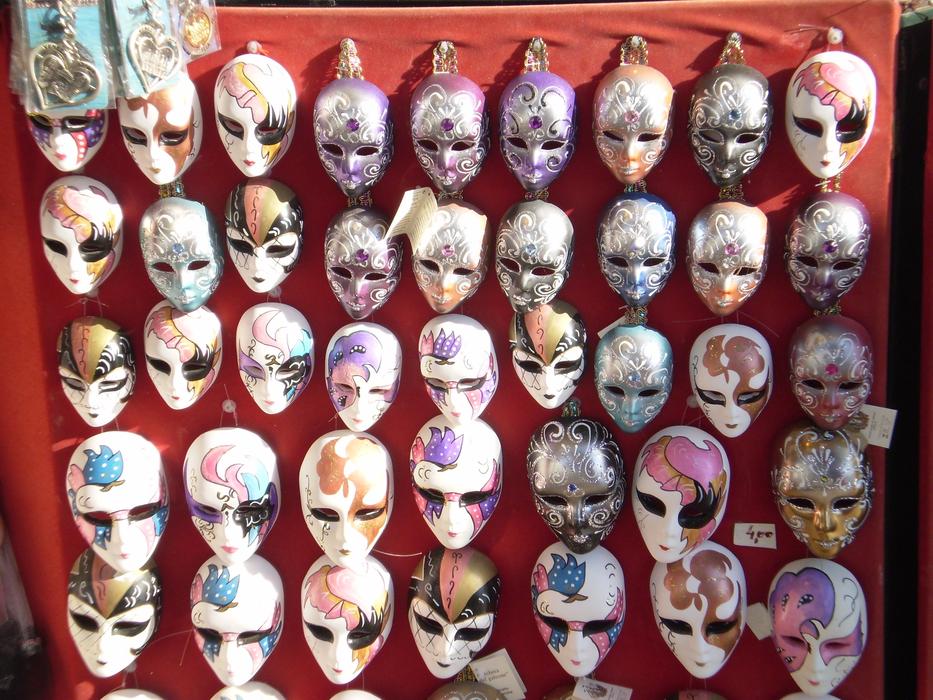 bright painted Carnival masks on stall, italy, venice