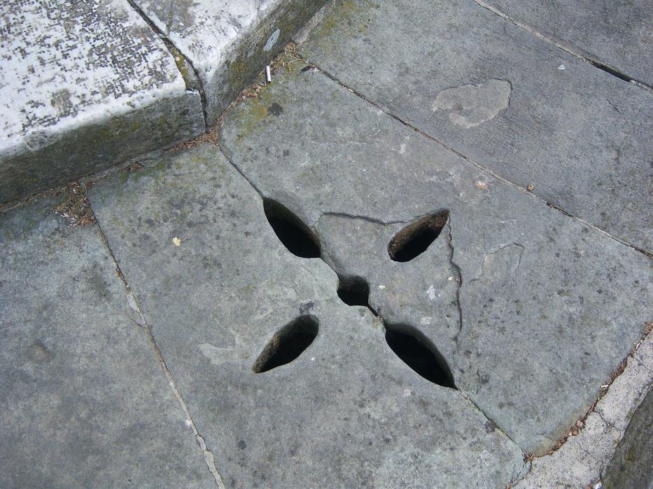 star shape holes in historical stone Sidewalk, italy, pisa