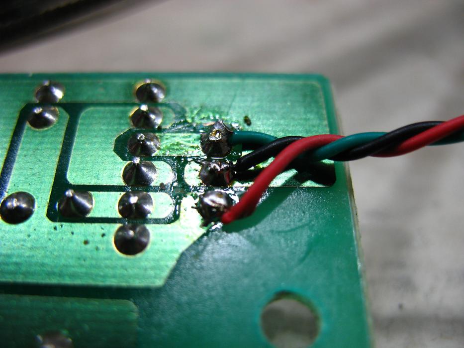 Printed circuit board with the colorful twisted wires, in light