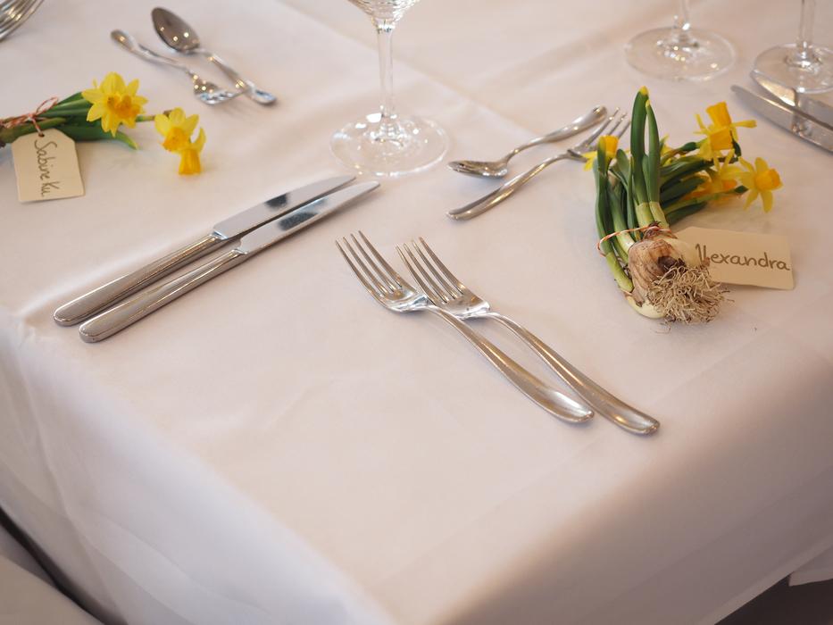 Cutlery and flowers on table served for wedding party