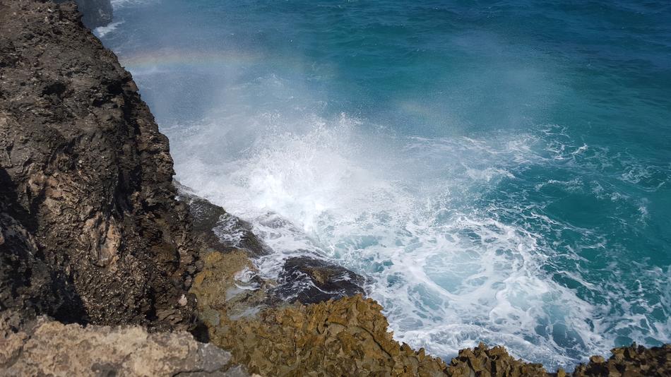 waves crashing against the rock