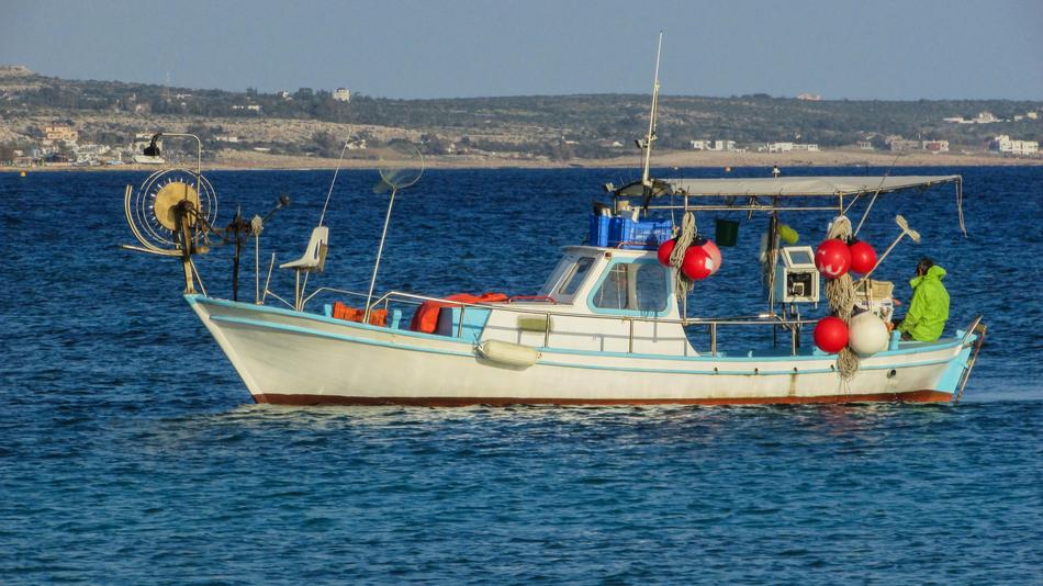 fishing boat in the blue sea