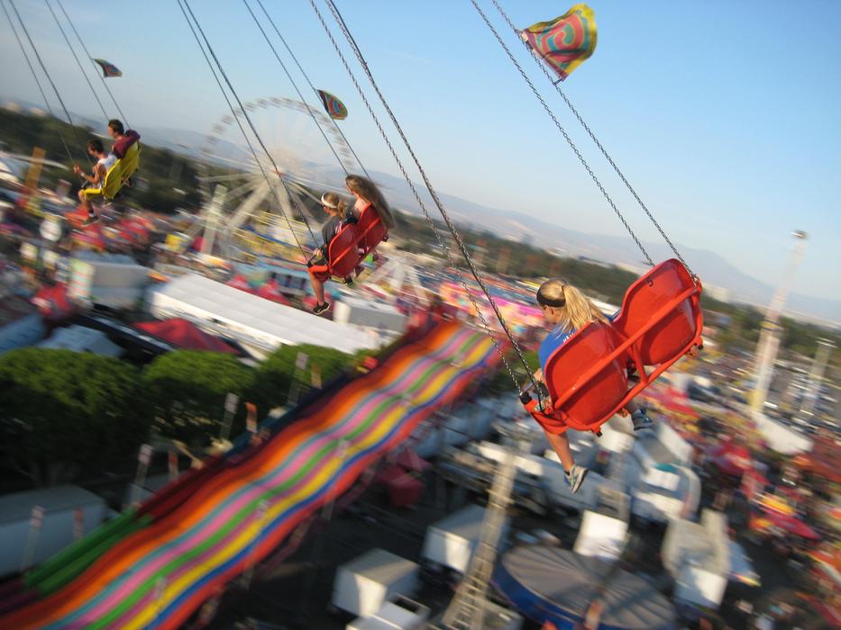 people on the merry blur ride