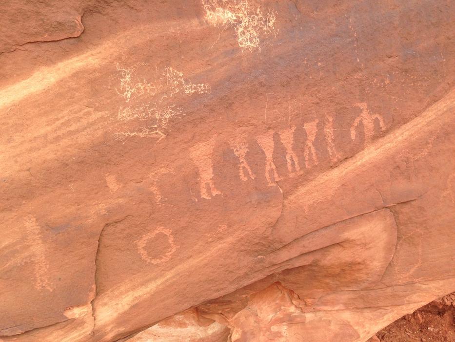 orange rock with drawings