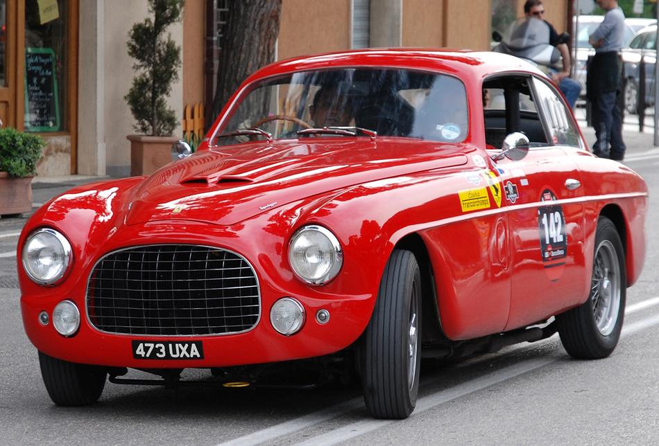 red sports car on the street
