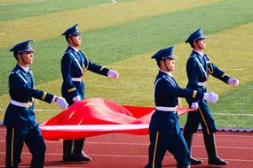 people carry a red flag