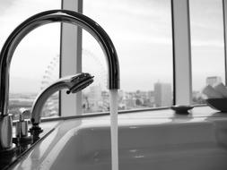 water dripping from the faucet in the bathtub