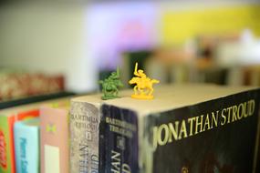 colored figures on books