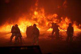 people put out a big fire