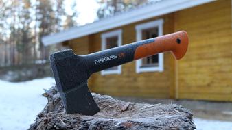an axe in a stump in winter