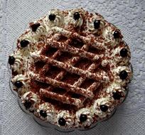 cream cake with chocolate sprinkles and berries