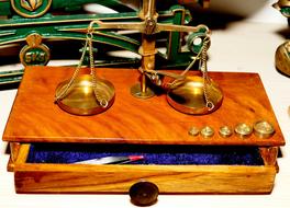wooden box with scales of justice