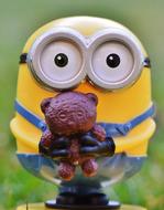 cute minion with a toy stands