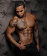 man with a tattoo on his chest