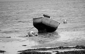 old boat on the sea by the beach