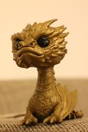 gold fantasy dragon on the table