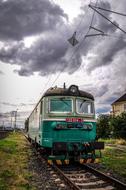 train on the tracks against a background of clouds