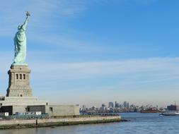 statue of liberty against a blue sky