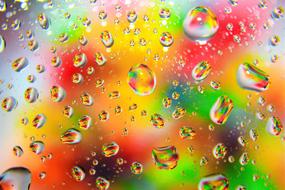 raindrops on the glass of the colored background