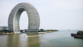 swirling building by the river