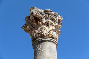 Column decorated with patterns on top
