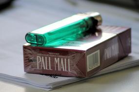 cigarette package with a lighter