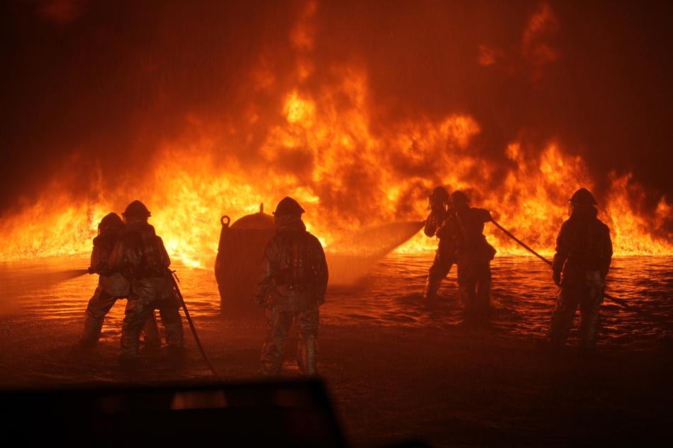 people put out a big fire