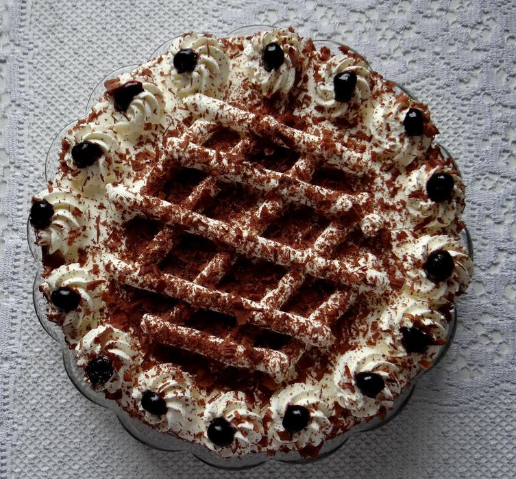 cream cake with chocolate sprinkles and berries