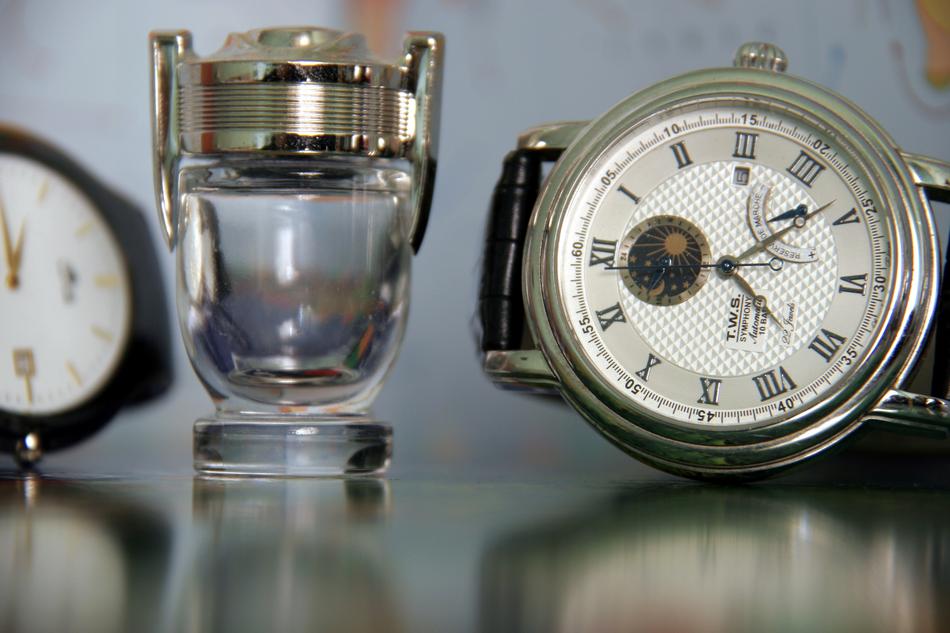 clock on the table with a glass