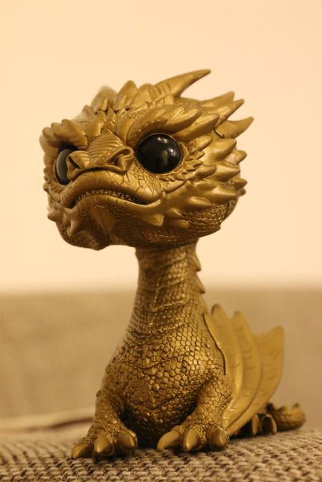 gold fantasy dragon on the table