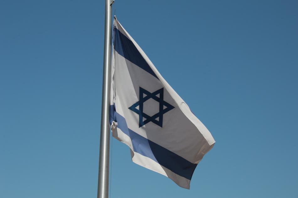 flag of israel is flying in the wind
