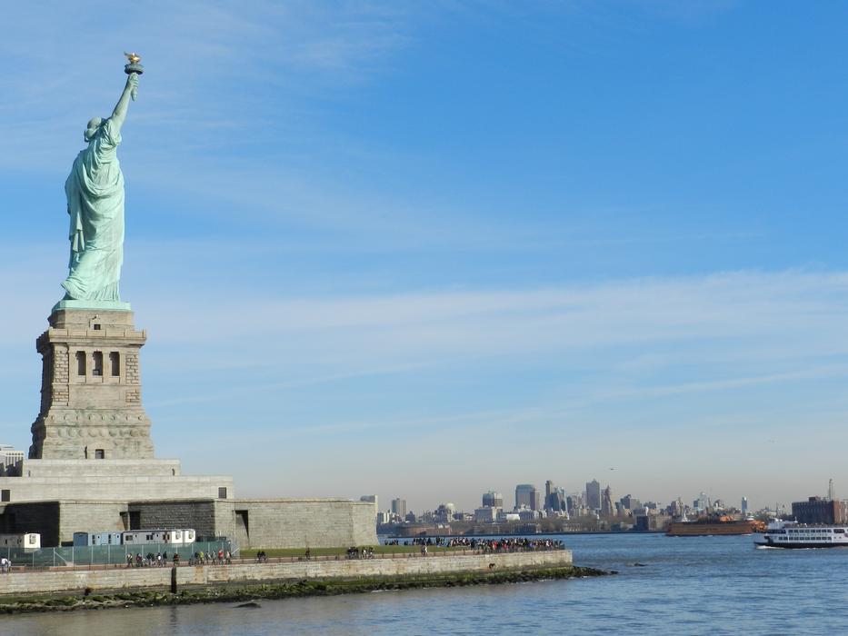 statue of liberty against a blue sky