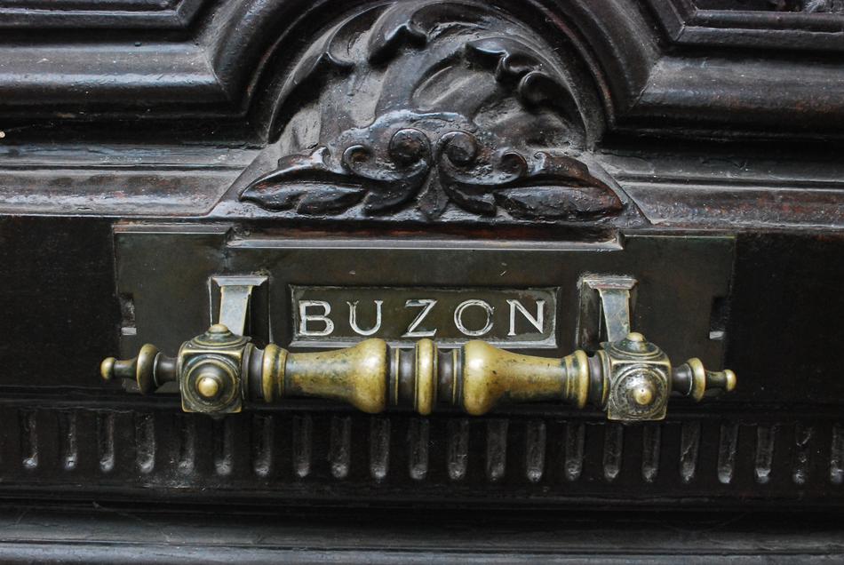 inscription on the handle of the mailbox
