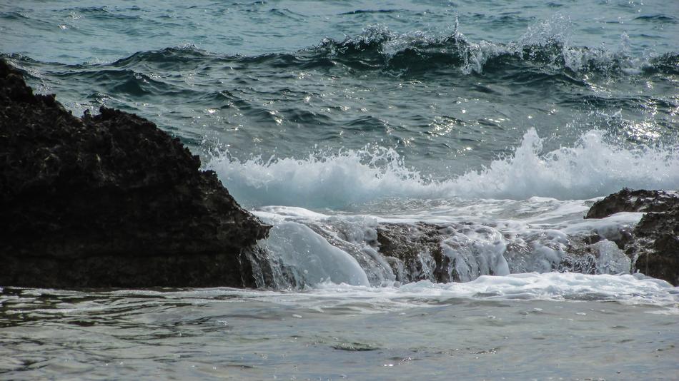 waves of the sea crashing against the rocks