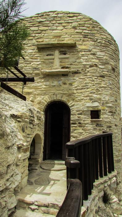 stone house with a wooden staircase