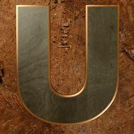 gold letter u on a wooden background