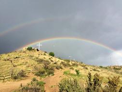 a bright rainbow in the fields