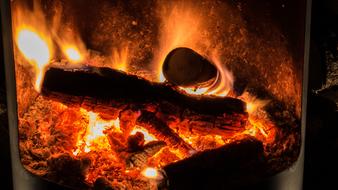 large burning logs in the fireplace