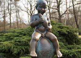 funny bronze sculpture of a boy