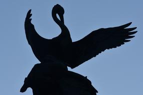 bird with wide open wings sculpture, back view