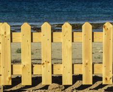 beautiful fence by the sea on the beach