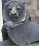 Stone sculpture of a lion with a shield