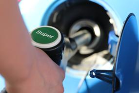 filling the car with gasoline