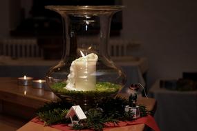 wax candle in a glass vase