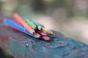 Broken crayons on the table
