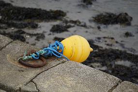 yellow float on the pier by the sea